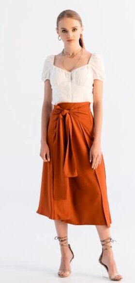 Full length view of fashionable woman posing on white